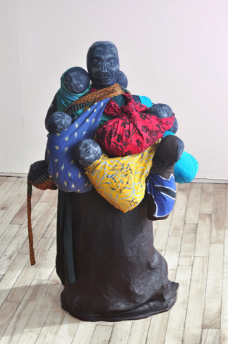 Carrying the Future, 2010. White pencil, acrylic, fabric, papier-mâché. 34x21x21 in - 90x53x53 cm