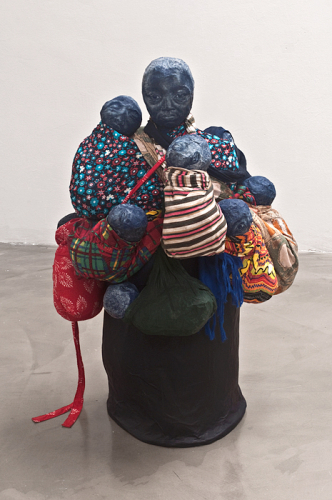 Carrying the Future, 2010. White pencil, acrylic, fabric, papier-mâché. 34x20x21 in - 86x50x53 cm