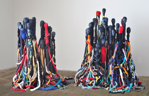 Crowd, 2011. White pencil, acrylic, papier-mâché, second-hand clothing. Left: 58x53x42 in - Cm 147.3x134.5x106.5 cm - Right: 66x60x50 in - 167.6x152.4x127 cm