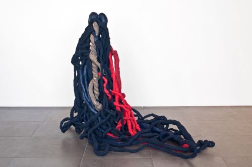 Dual (1), 2012. White pencil, acrylic, papier-mâché, fabric, wood, concrete. 50x64x33 in - 127x152.5x83 cm