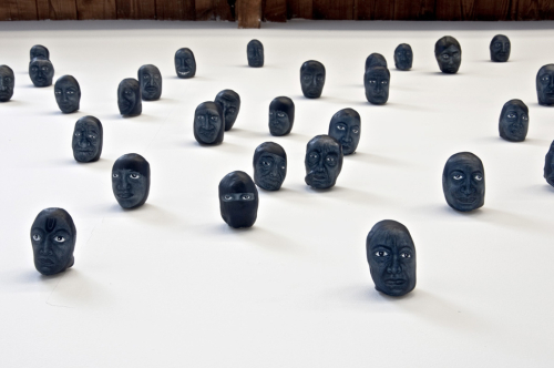 Toward, 2012. White pencil, acrylic, porcelain. Variable dimension. 230 portraits, 2x2x3 in  -  5x5x7 cm each.